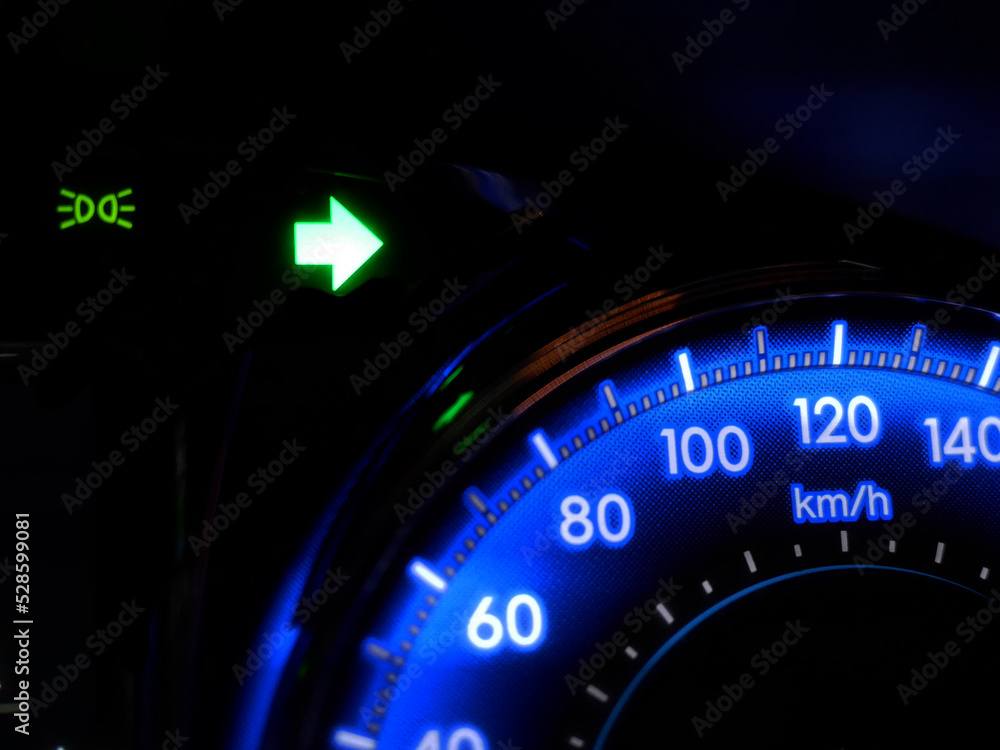 car turning signal lights on car dashboard.