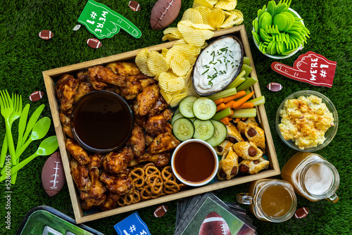 Overhead view of fun and healthy snacks and beer for fun celebrating game day with family and friends.