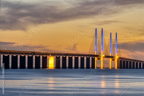 The famous Oresund bridge between Denmark and Sweden after sunset photo