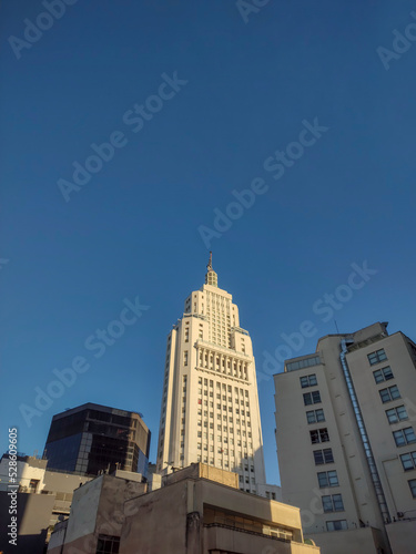 Amazing vertical view of the Altino Arantes Building, Banespa, on a sunny afternoon with blue sky in the background, Centro Histórico, São Paulo, Brazil