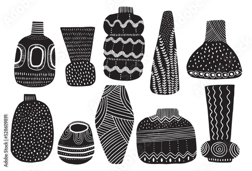 Vases patterned in linocut style isolated on white background photo