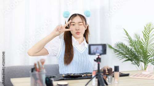 Beautiful woman with a social media influence is greeting the audience for recording vlog video live streaming, Showing how to make up and use cosmetics, Online business on concept of beauty bloggers.