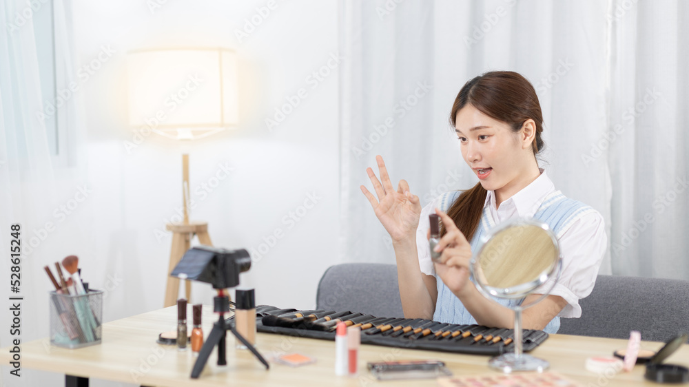 Beautiful women with social media influences are teaching makeup and use cosmetics, In front of the camera to recording vlog video live streaming, Online business on concept of beauty bloggers. Beautiful women with social media influences are teaching makeup and use cosmetics, In front of the camera to recording vlog video live streaming, Online business on concept of beauty bloggers.