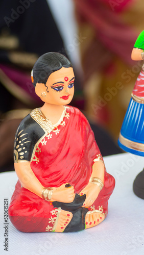 Thanjavur Doll Terra-cotta Doll, Indian toy and traditional dress and ornaments in a Natural background. photo