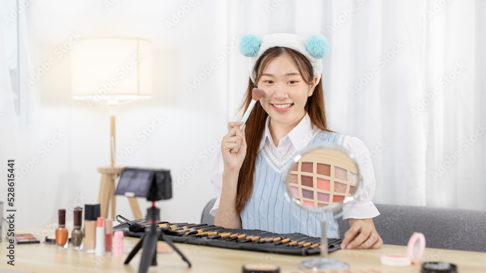Beautiful women with social media influences are teaching makeup and use cosmetics, In front of the camera to recording vlog video live streaming, Online business on concept of beauty bloggers.