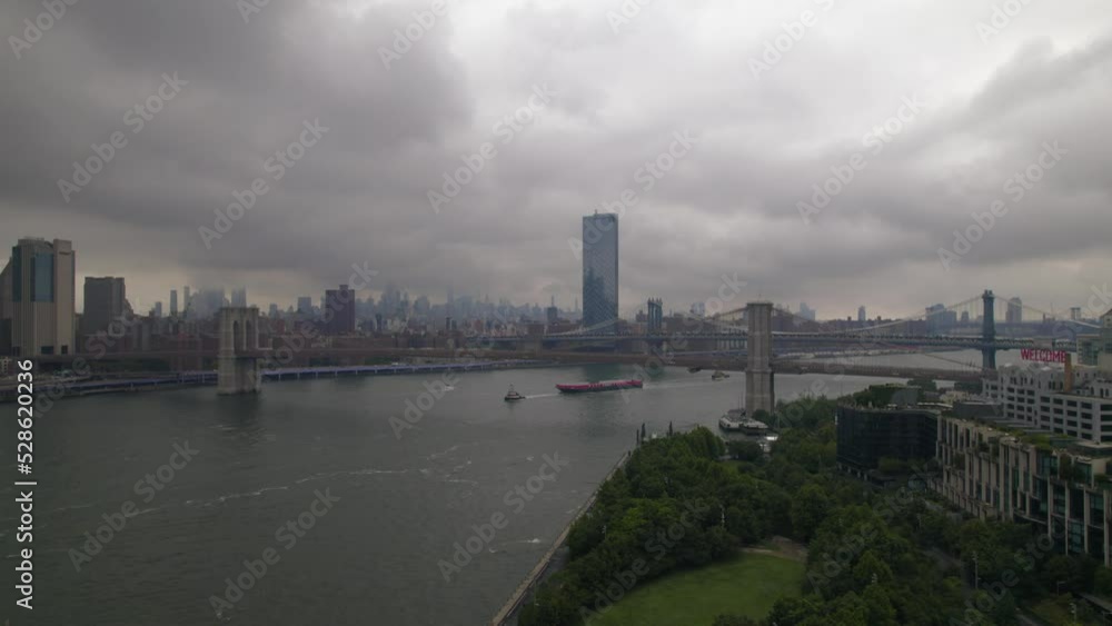 Aerial view on Brooklyn bridge on overcast weather in New York, Manhattan. Hudson river of New York. Attraction of New York most popular bridge in the USA. Famous place for tourists in the World. Doll Aerial view on Brooklyn bridge on overcast weather in New York, Manhattan. Hudson river of New York. Attraction of New York most popular bridge in the USA. Famous place for tourists in the World. Doll