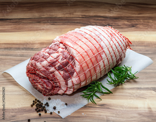 Boneless Leg of Lamb with rosemary, rock salt and peppercorn on wax paper