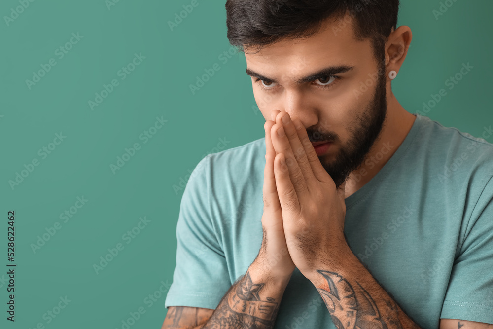 Portrait of worried bearded man on green background Portrait of worried bearded man on green background