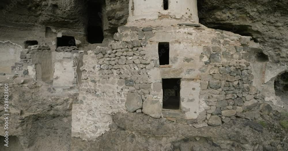 Remains Of The Vanis Kvabebi Cave Monastery In Samtskhe-Javakheti Region Of Georgia - aerial pullback Remains Of The Vanis Kvabebi Cave Monastery In Samtskhe-Javakheti Region Of Georgia - aerial pullback