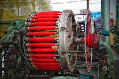 red weft linen threads on a jacquard loom