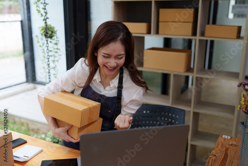 Asian SME business woman working at home office. online shopping concept