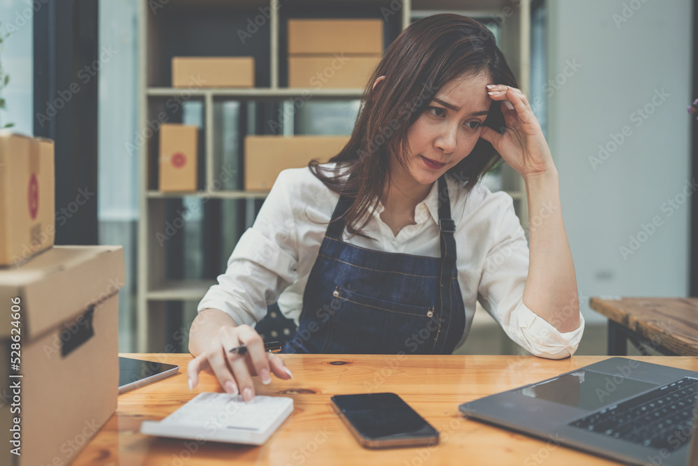 Asian SME business woman working at home office. online shopping concept Asian SME business woman working at home office. online shopping concept
