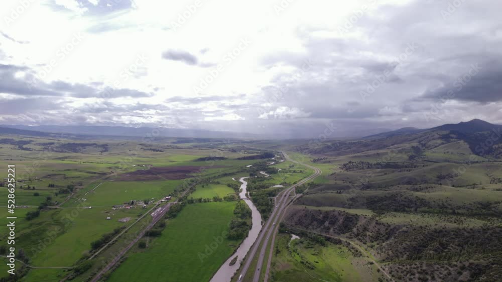 Top view on highway between mountain in Montana. Beautiful landscape with mountain road in the USA. Top view on highway between mountain in Montana. Beautiful landscape with mountain road in the USA.