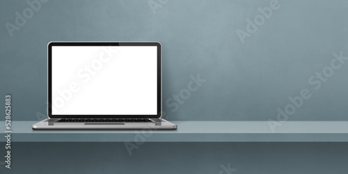 Laptop computer on grey shelf background banner