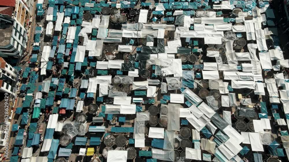 Panoramic View Over Plaza de Ponchos (Mercado de Ponchos) In The City Of Otavalo In Ecuador - drone shot Panoramic View Over Plaza de Ponchos (Mercado de Ponchos) In The City Of Otavalo In Ecuador - drone shot