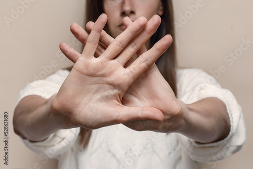 Woman's palm close up, gesture stop and don't move, stop domestic violence