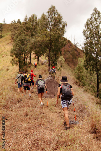 a group of people walking on the trek