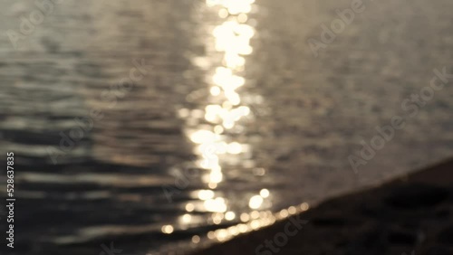 unfocused waves crashing against the shores of the lake. berzdorfer see, saxony, germany photo