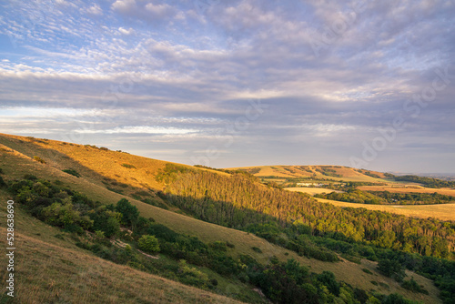 Morning golden hour on the south downs hills of Butts Brow near Eastbourne East Sussex south east England  © SuxxesPhoto
