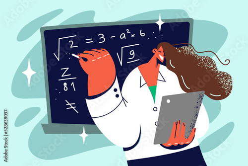 Female teacher writing on blackboard 