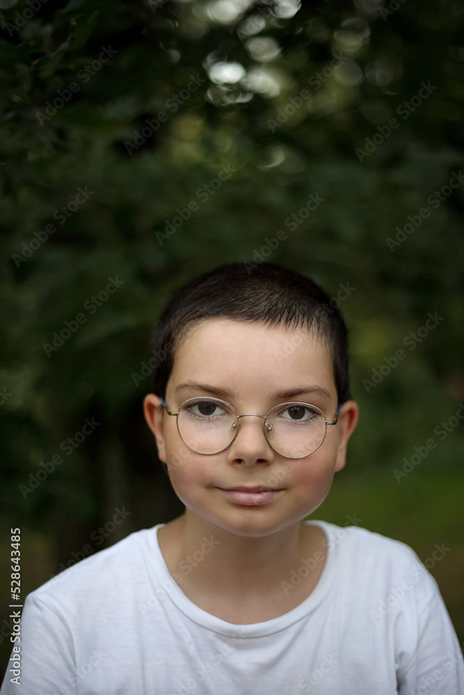 Portrait of a teenage girl with glasses in the woods in Poland Portrait of a teenage girl with glasses in the woods in Poland