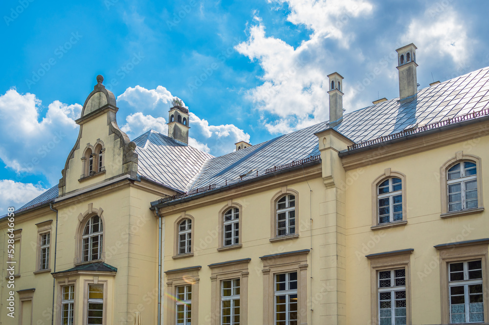 Fototapeta premium A palace and park complex from the nineteenth eclectic style. Przyszowice, Poland