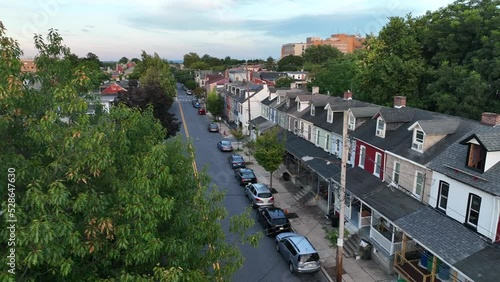 Crime and poverty in urban downtown USA. Aerial establishing shot of homes in town in East Coast America. photo