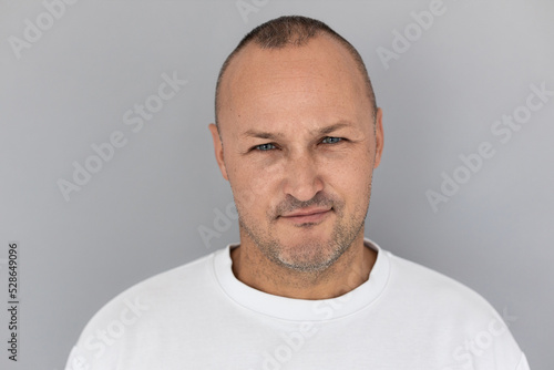 Wall Mural Close-up of mature Caucasian man looking at camera