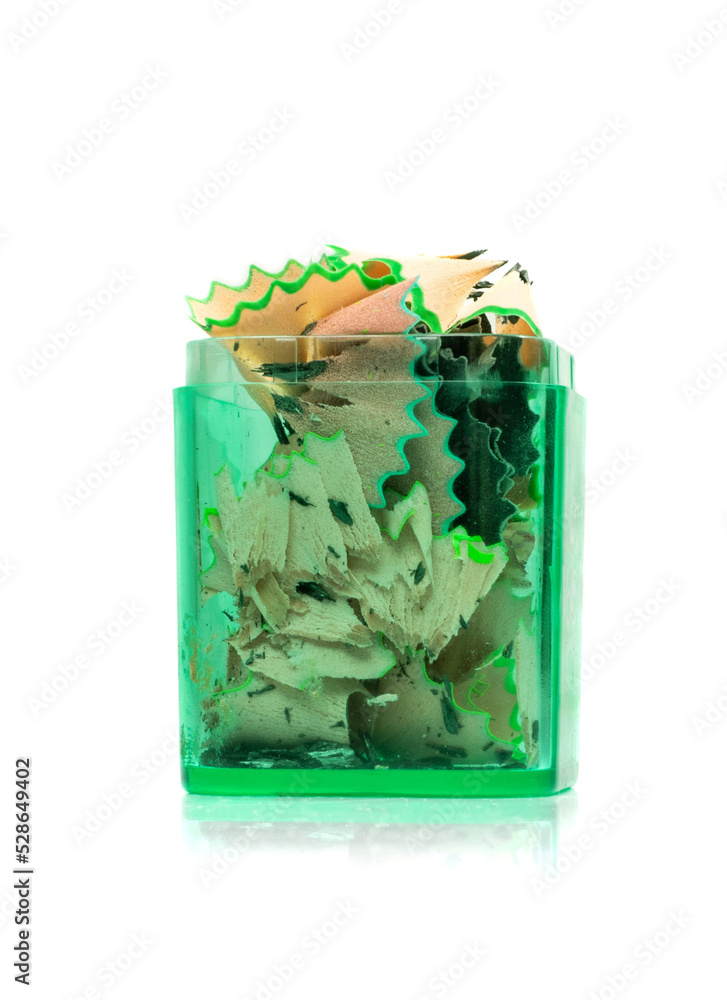 Fototapeta premium Color Wood Pencil Shavings in Pencil Sharpener Isolated
