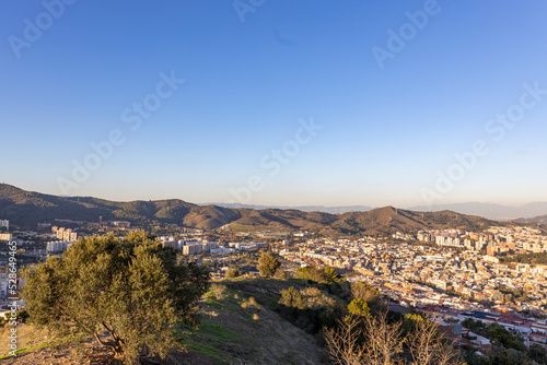 Barcelona skyline at sunny day. City landscape view from the mountain.