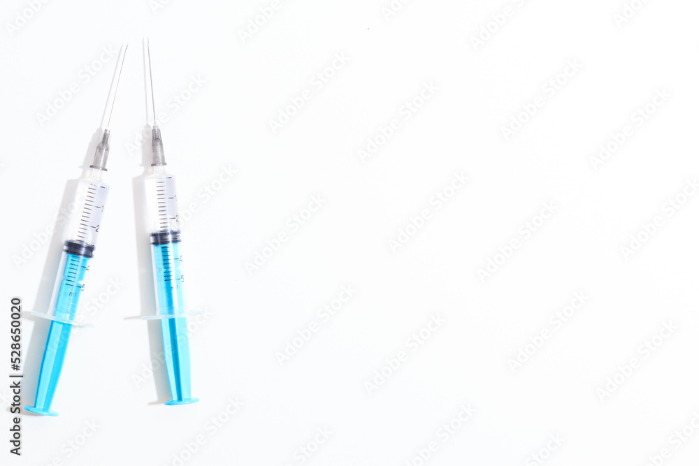 Disposable plastic syringe prepared for injection and vaccination in the hospital. The concept of medicine and health Disposable plastic syringe prepared for injection and vaccination in the hospital. The concept of medicine and health