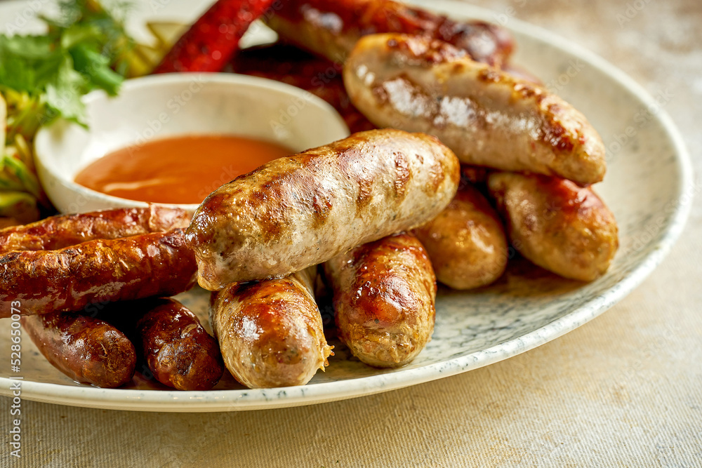 German grilled sausages. Close-up selective focus. An appetizer for beer German grilled sausages. Close-up selective focus. An appetizer for beer