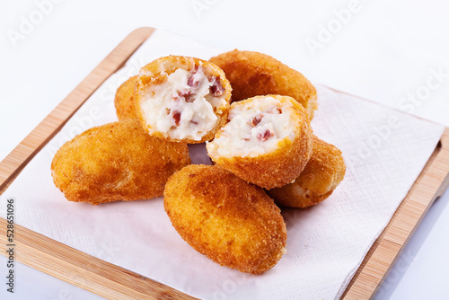 Tapa of croquetas or croquettes	on white background 