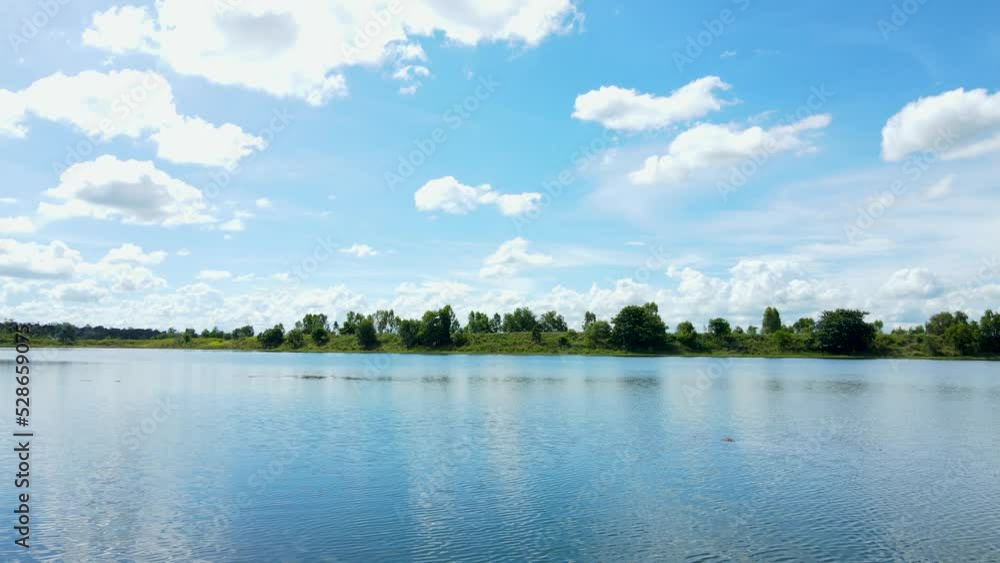 Fly along the blue lake Along with the sky and clouds. There are green Trees on the horizon. lake, river, blue lake, blue river, forest, Landscape Fly along the blue lake Along with the sky and clouds. There are green Trees on the horizon. lake, river, blue lake, blue river, forest, Landscape