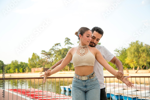 Sensual couple dancing in the street