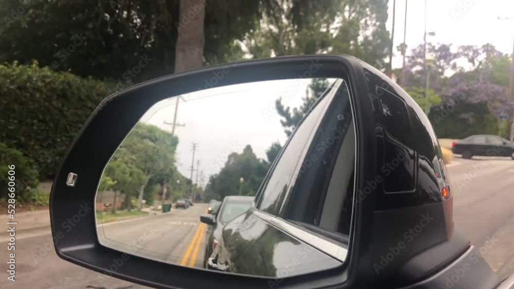 Driving down road mirror view Driving down road mirror view