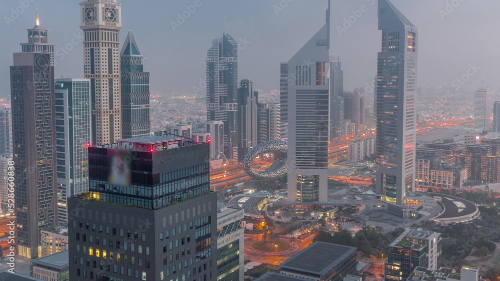 Skyscrapers on Sheikh Zayed Road and DIFC night to day timelapse in Dubai, UAE. Skyscrapers on Sheikh Zayed Road and DIFC night to day timelapse in Dubai, UAE.
