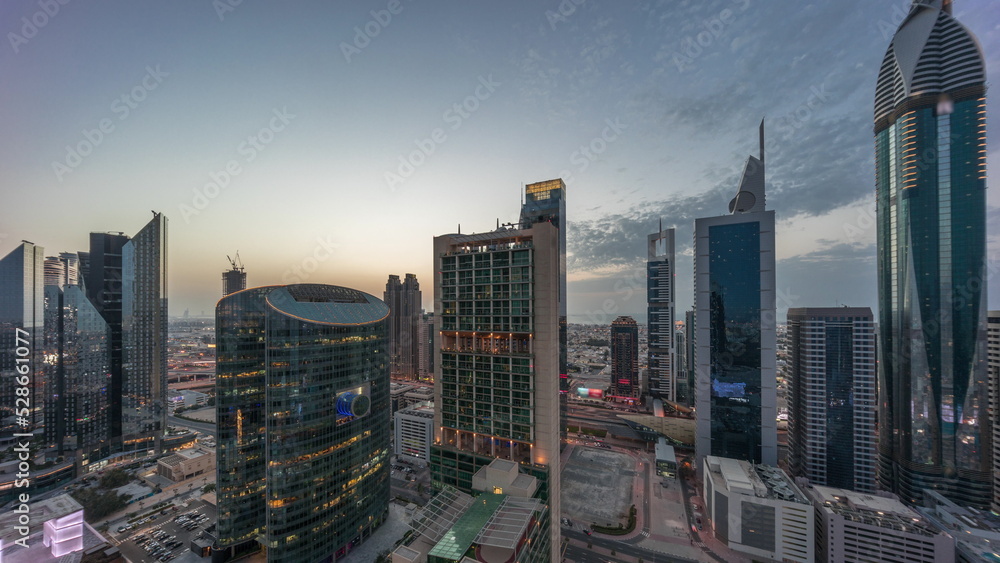 Dubai international financial center skyscrapers aerial day to night timelapse.