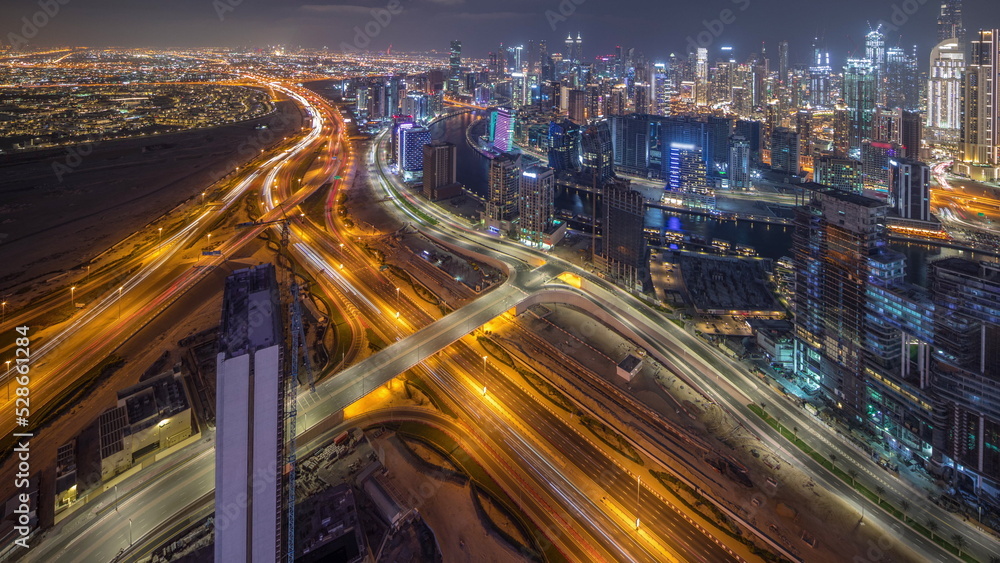 Panorama showing skyline of Dubai with business bay and downtown district night timelapse. Panorama showing skyline of Dubai with business bay and downtown district night timelapse.