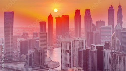 Wallpaper Mural Skyline with modern architecture of Dubai business bay towers at sunset timelapse. Aerial view Torontodigital.ca
