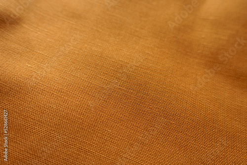 Closeup of brownish orange hemp and cotton fabric
