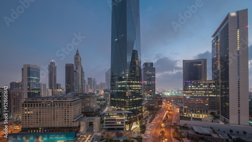 Dubai International Financial district aerial night to day timelapse. Panoramic view of business office towers.