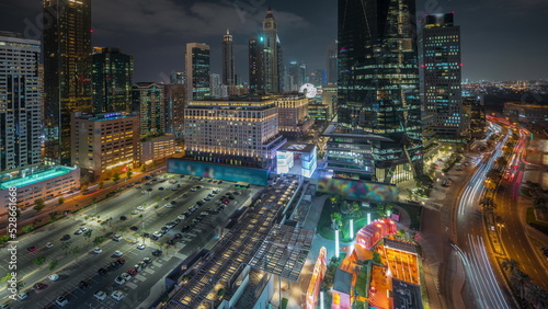Panorama showing Dubai International Financial district aerial night timelapse. View of business and financial office towers. © neiezhmakov