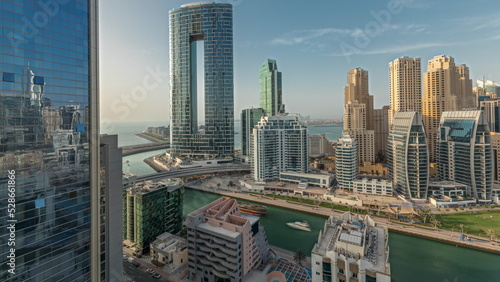 Panorama showing Dubai Marina skyscrapers and JBR district with luxury buildings and resorts aerial timelapse © neiezhmakov