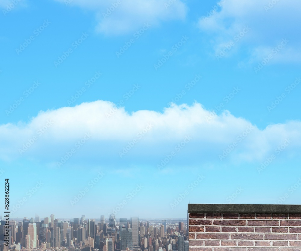 Cityscape and brick wall against sky