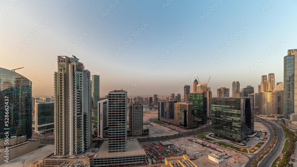 Fototapeta premium Business Bay Dubai skyscrapers with water canal aerial timelapse.