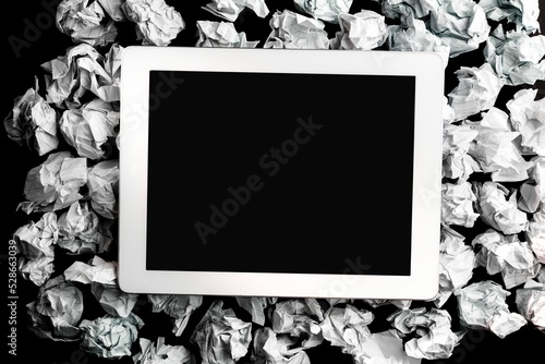 Digital tablet on crumpled paper