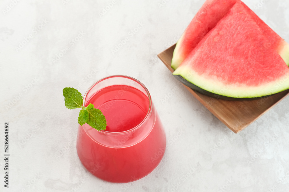 Fresh watermelon juice with mint, cold pressed juice. Healthy drink concept.
Fresh watermelon juice with mint, cold pressed juice. Healthy drink concept.