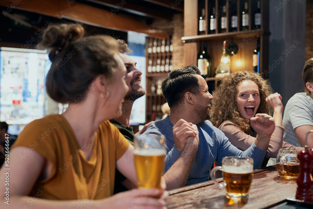 Group of friends spending time in bar together Group of friends spending time in bar together