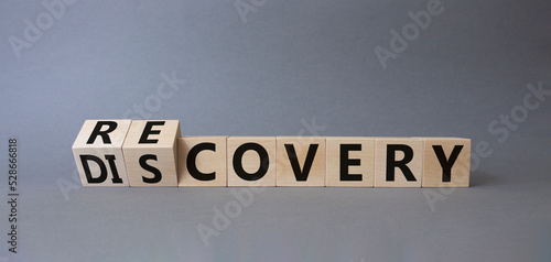Recovery and Discovery. Turned wooden cubes with words Recovery and Discovery. Beautiful grey background. Business concept. Copy space © Natallia